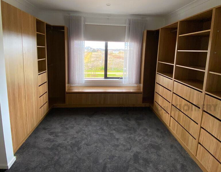 Walk-in closet with hanging and shelving in Melbourne