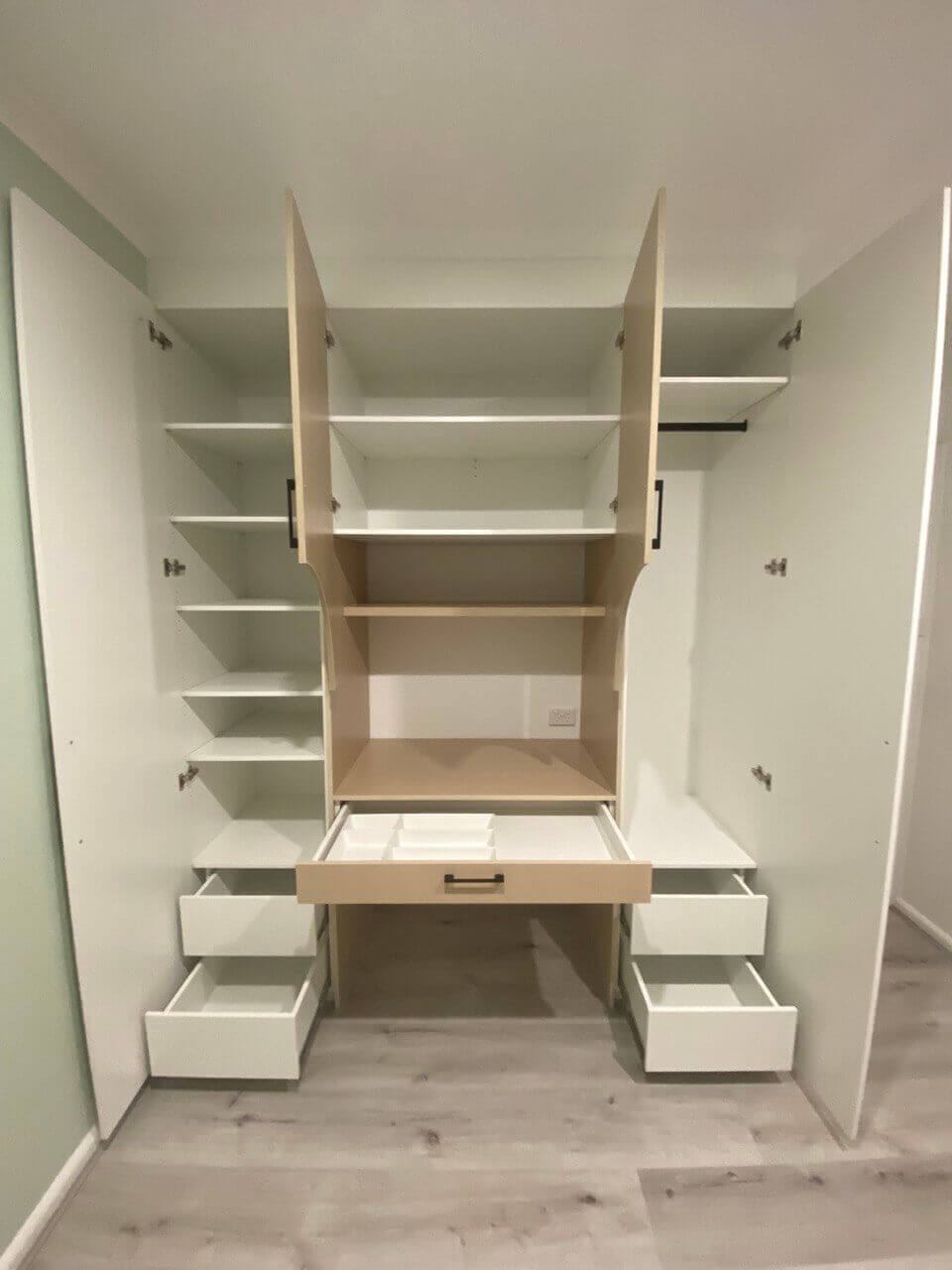 Custom study desk with overhead cabinetry