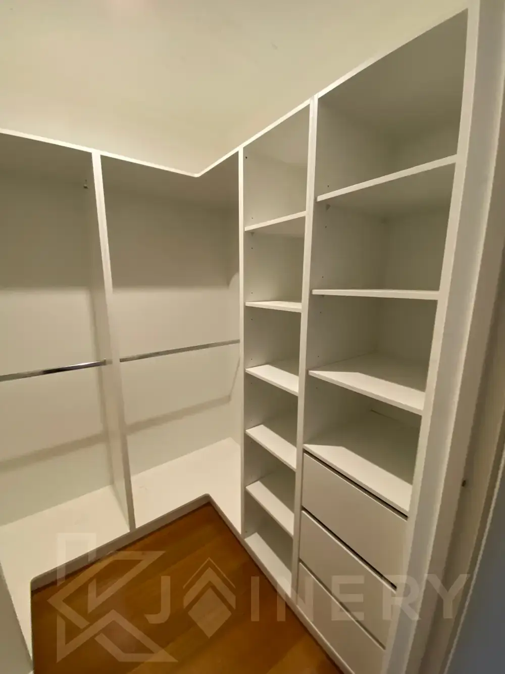 White walk-in robe with adjustable shelving being installed in Melbourne by KJoinery Australia