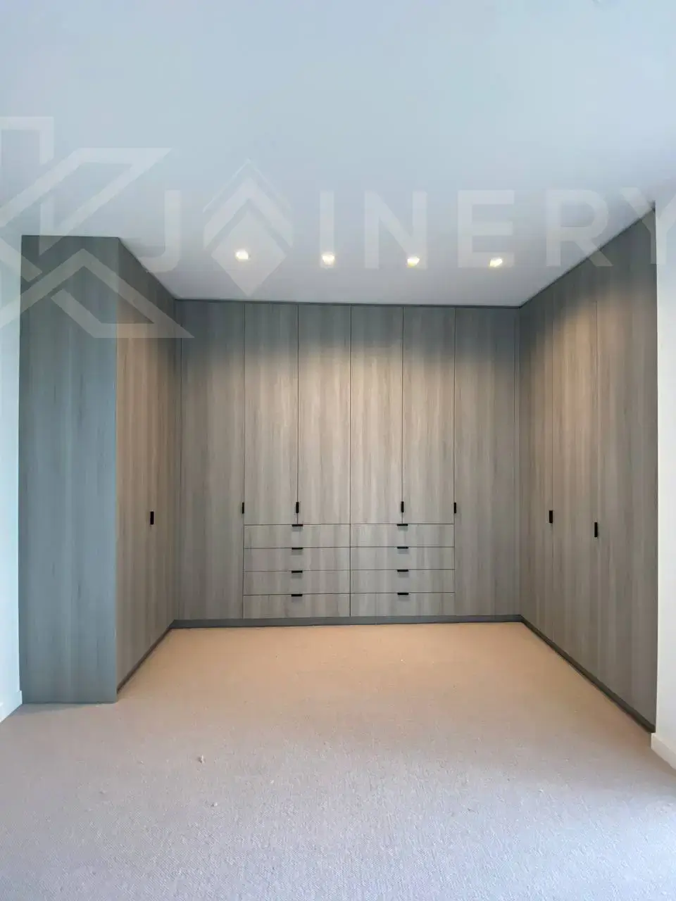 Custom walking robe Point Cook — walk-in wardrobe with open shelving, hanging sections and island drawers