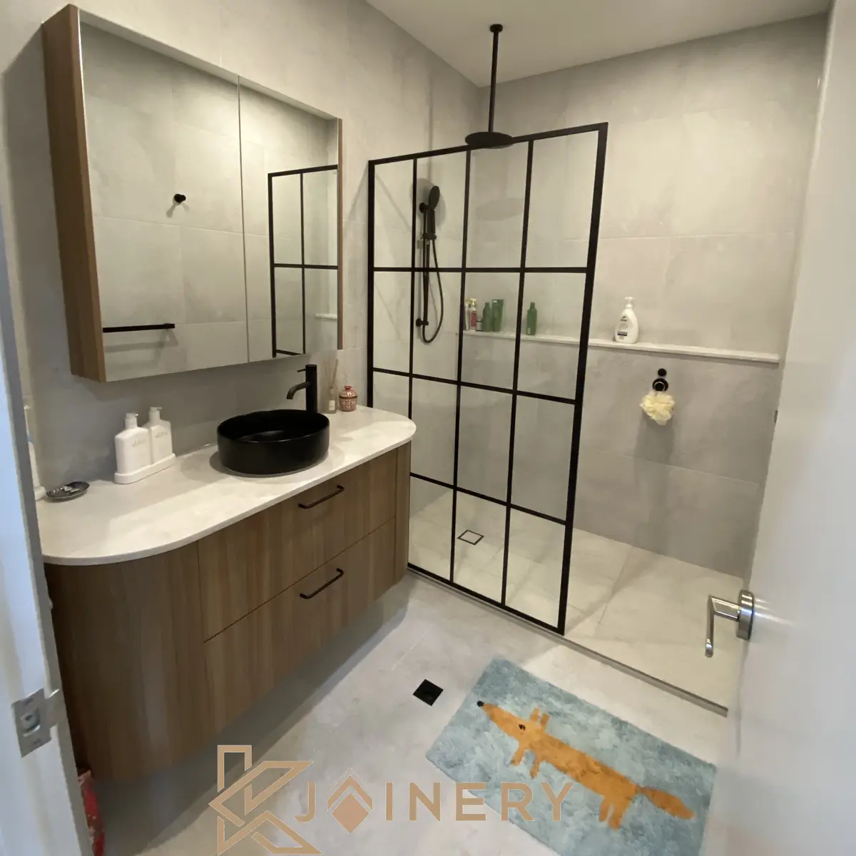 Bathroom vanity installation Point Cook — floating wall-hung vanity with floor-to-ceiling tiling and custom mirror
