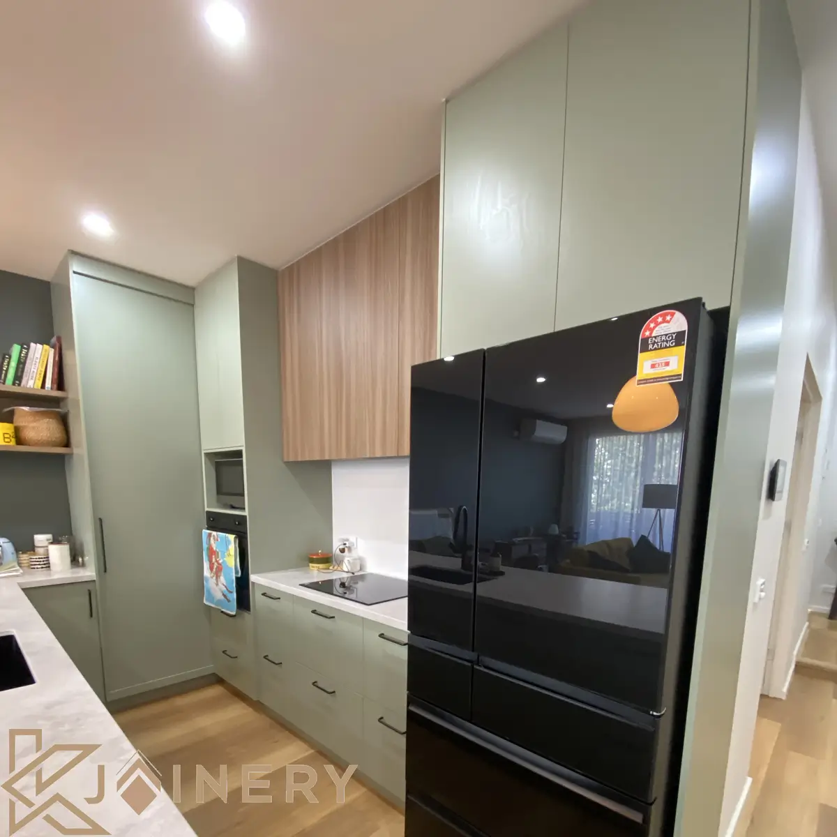 Custom kitchen renovation Ascot Vale — KJoinery built-in cabinetry with stone benchtop and integrated appliances