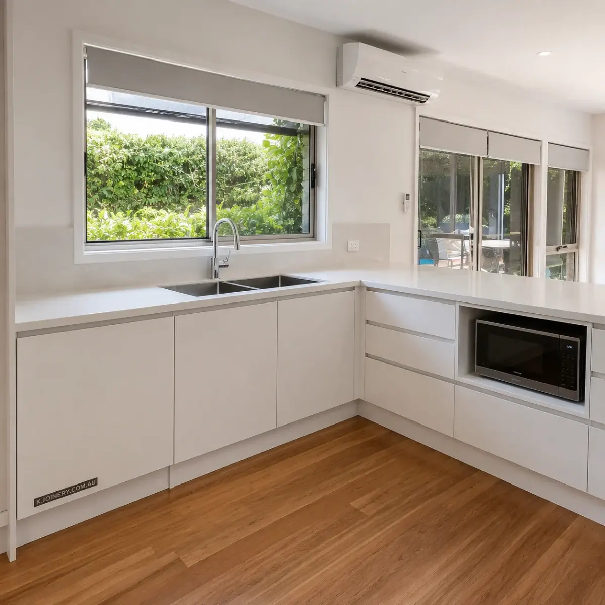 White custom kitchen with timber floor in Williams Landing Melbourne