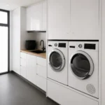 Concealed European laundry with full-height cabinetry and integrated appliances in Melbourne
