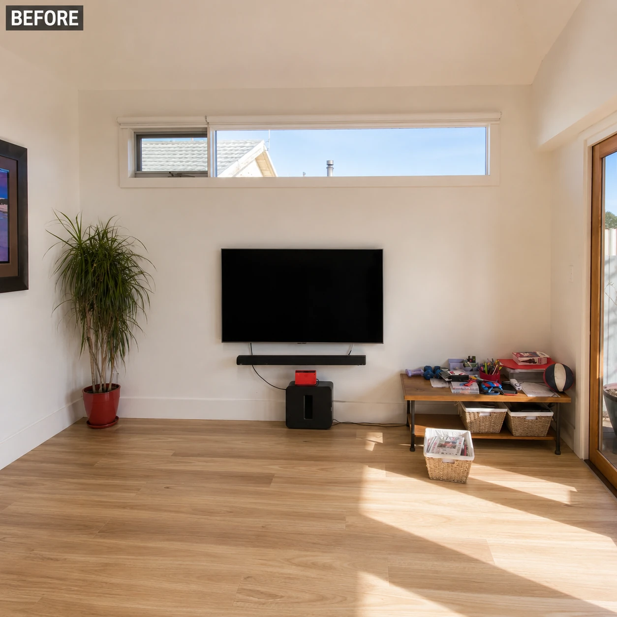 Living room with a bare wall and exposed soundbar before TV unit installation in Footscray Melbourne
