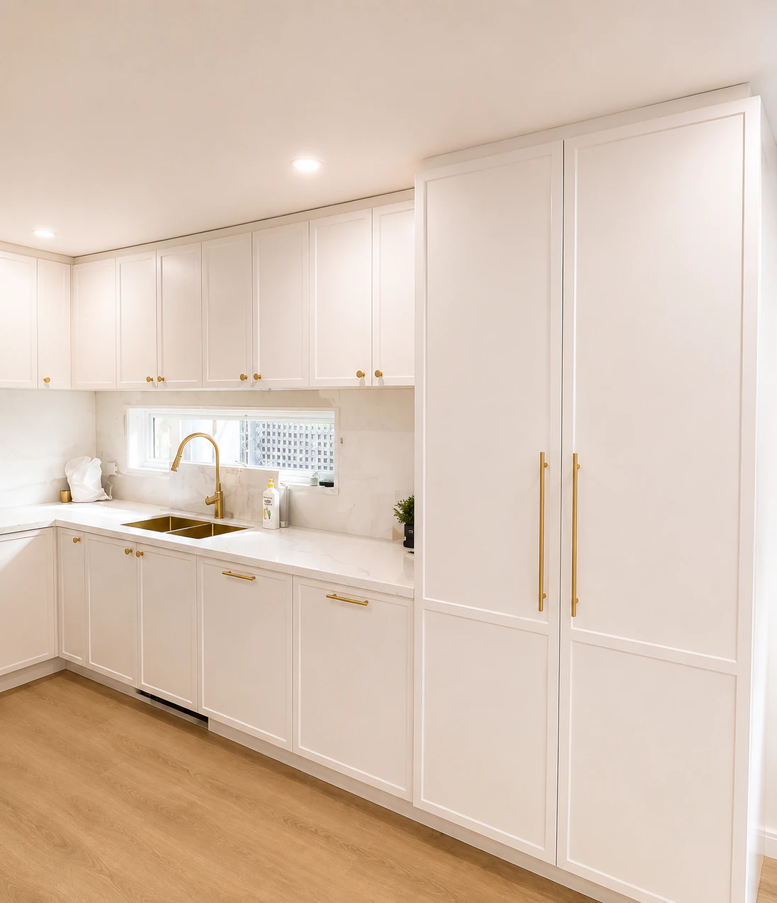 Floor to ceiling pantry cabinets beside the sink run in the Bulleen kitchen