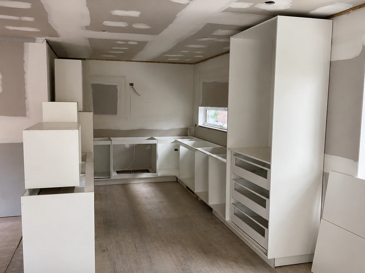 Cabinet carcasses and pantry tower being installed in the Bulleen kitchen