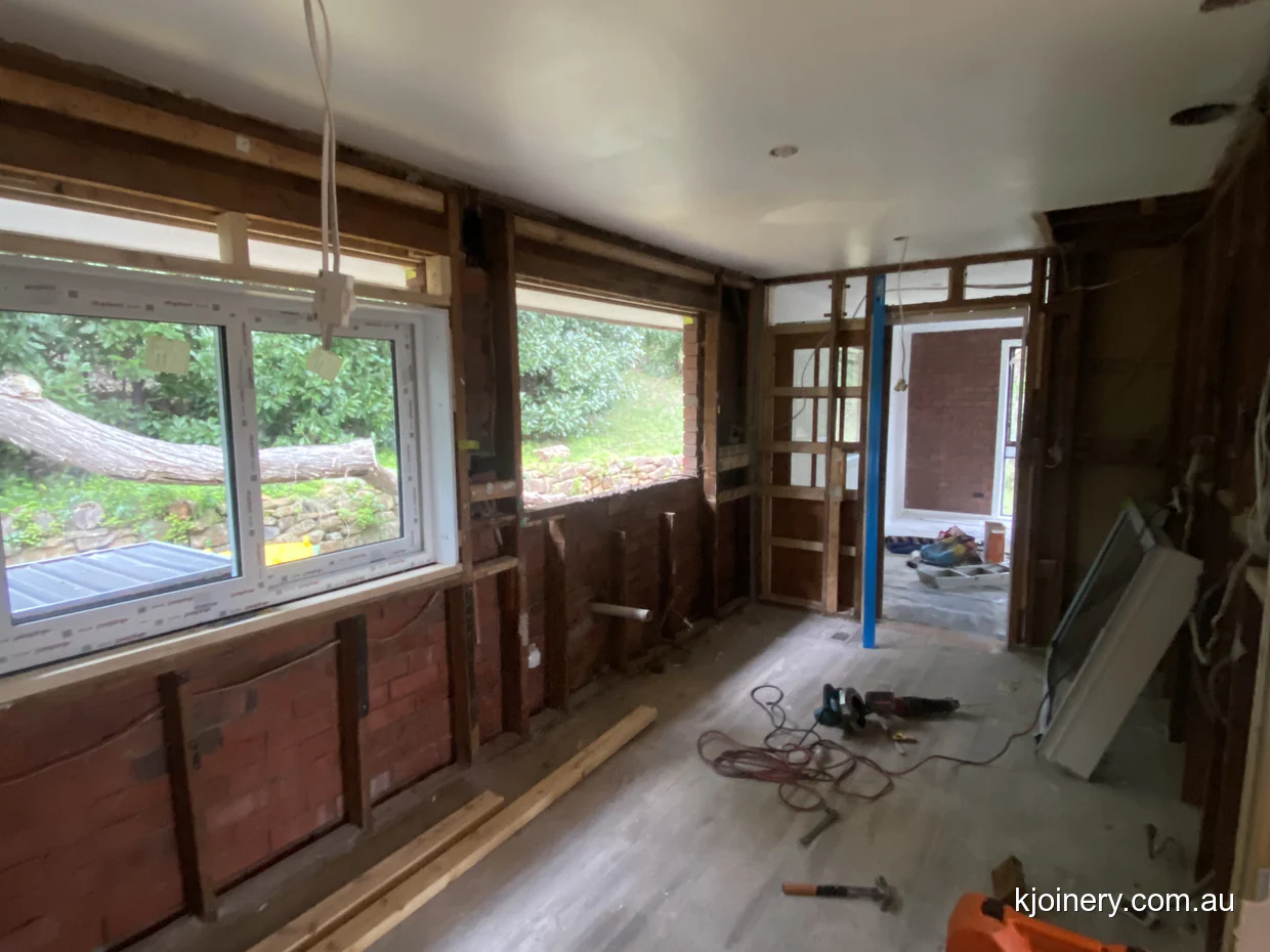 Essendon kitchen renovation with the room propped and stripped back to the frame