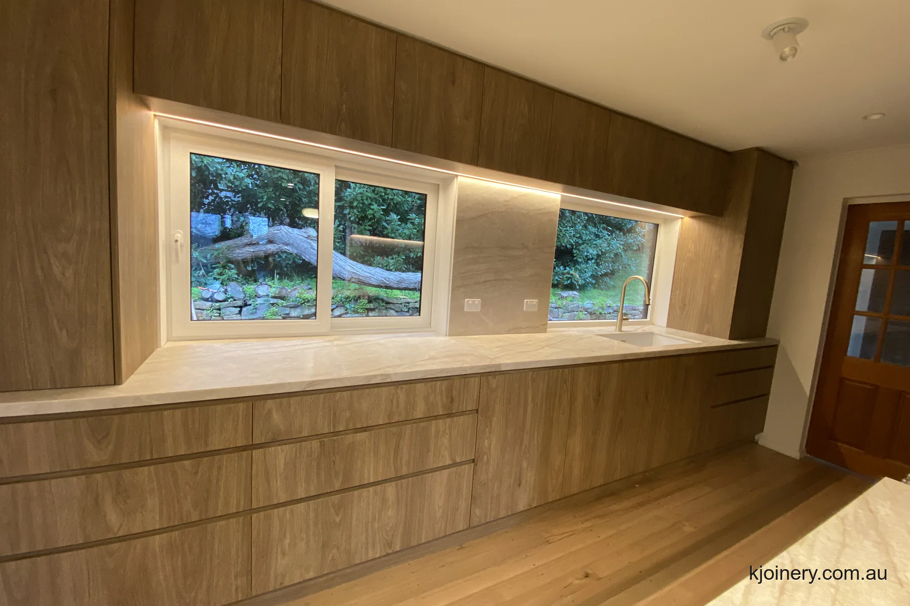 Kitchen renovation in Essendon with Laminex Prime Oak cabinetry and a Santorini Gold stone benchtop