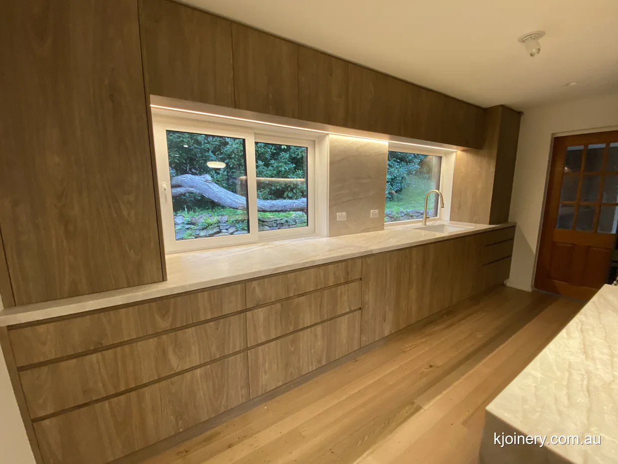 Finished Prime Oak and Santorini Gold galley kitchen in Essendon