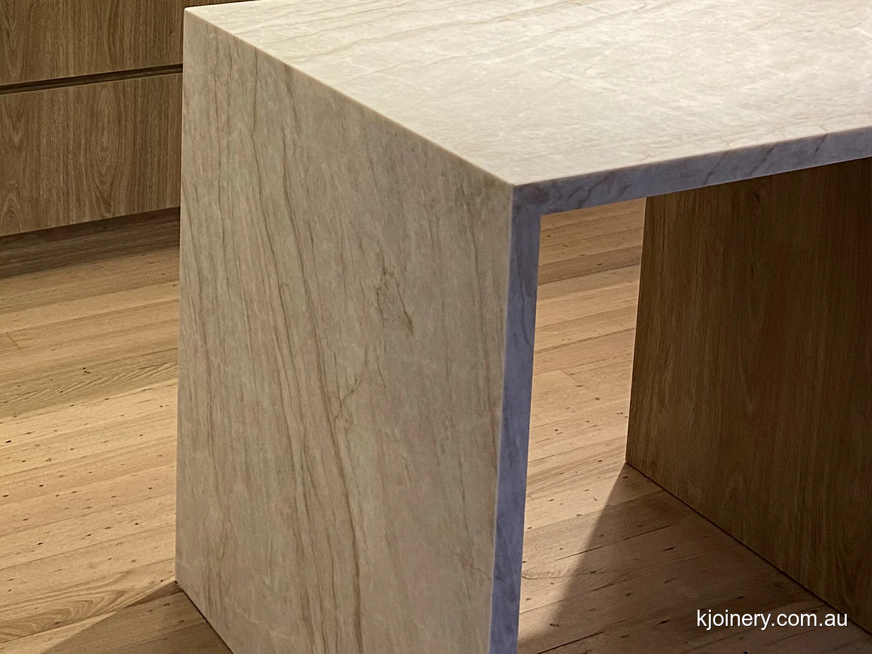 Mitred waterfall edge on a Santorini Gold stone peninsula in Essendon