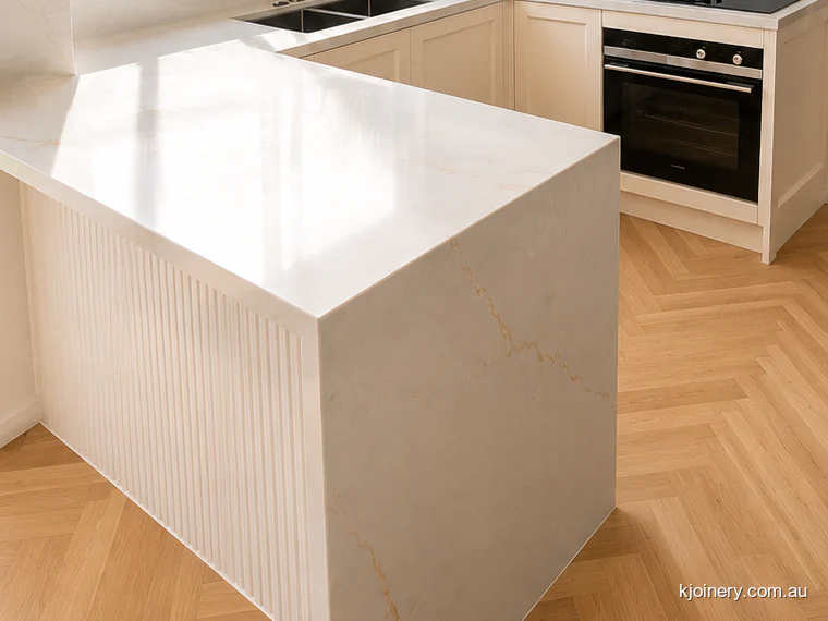 Fluted peninsula panel and mitred stone benchtop in a Caroline Springs kitchen