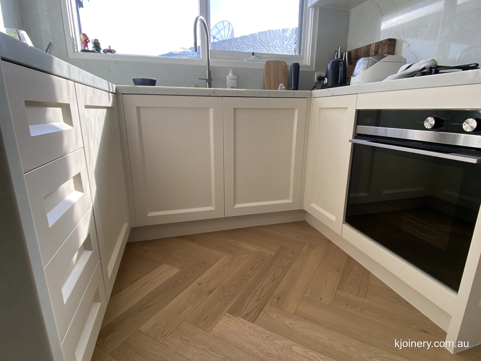 Kitchen cabinets being fitted in Caroline Springs, showing the oven bank and drawer fronts