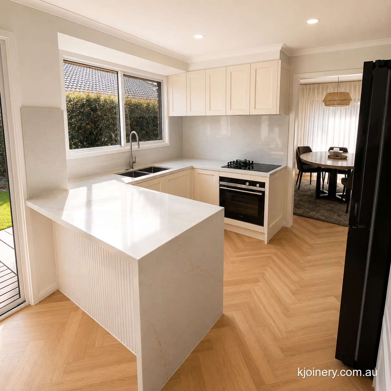 Kitchen renovation in Caroline Springs with shaker cabinetry, a stone peninsula and herringbone flooring