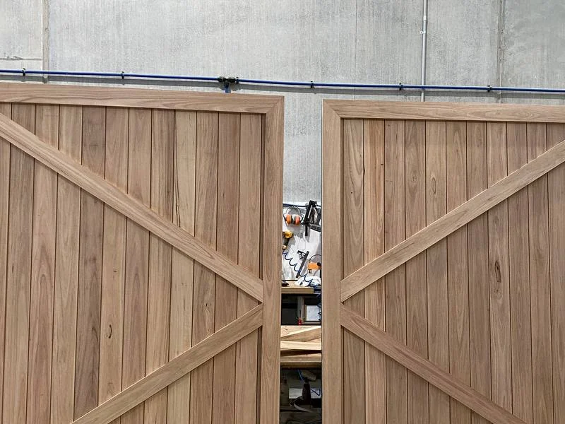 Close up view of the precision mitred chevron cross-brace joint on custom timber barn door
