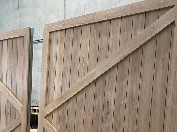 Detailed timber grain and vertical v-groove profile on custom Australian hardwood barn door