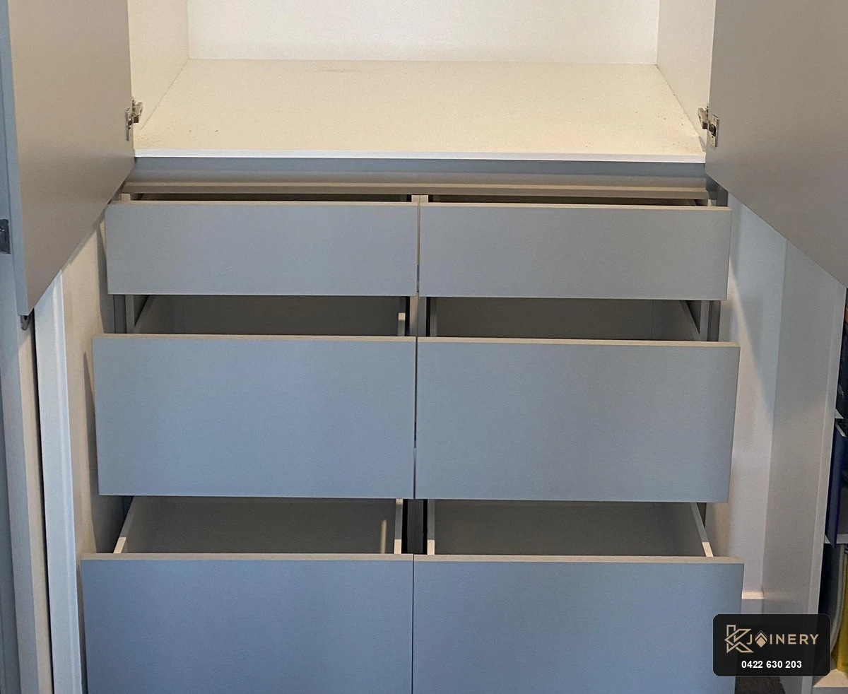 Close-up detail of 6 soft-close drawers on built in wardrobe with drawers in Footscray home