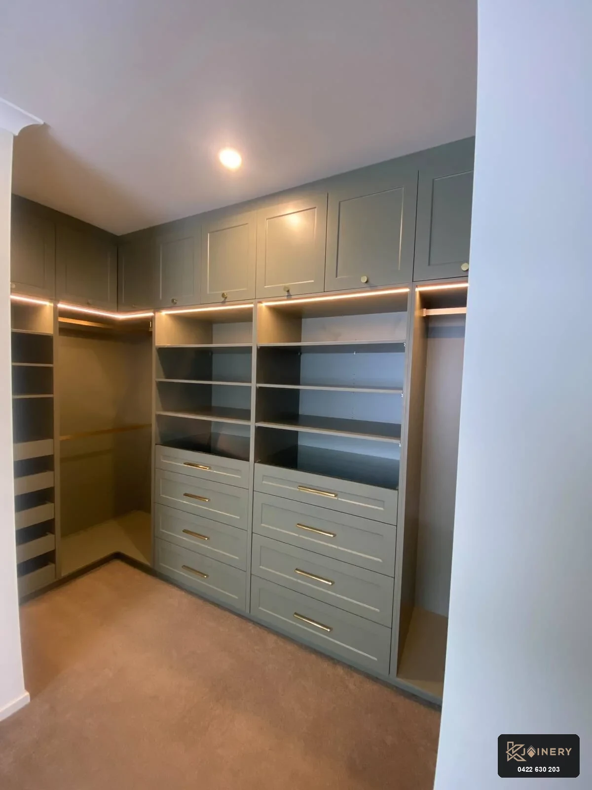 Shaker walk-in wardrobe Point Cook drawers finished in sage green 2-pack polyurethane with brass handles