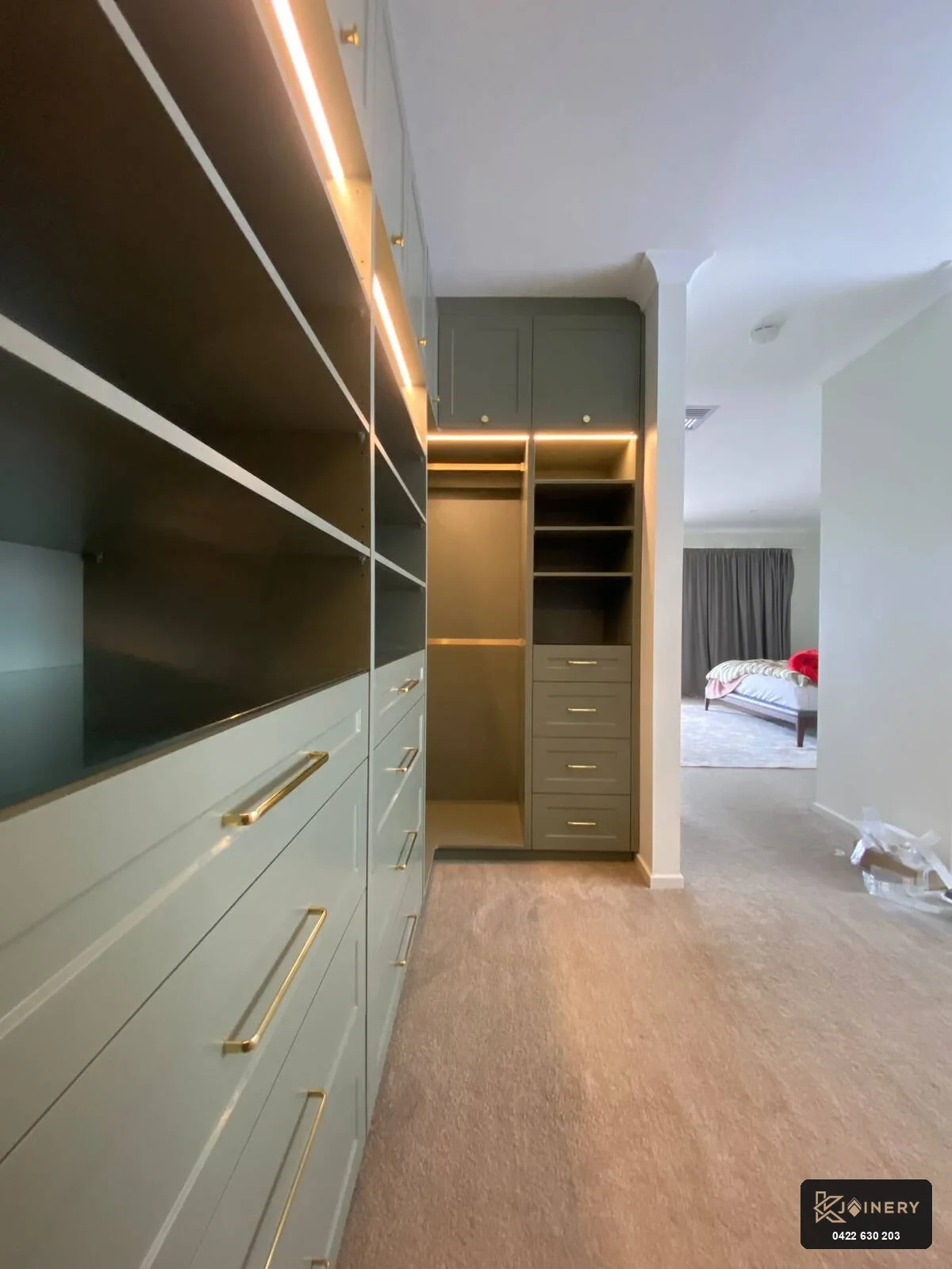 Walk-in robe joinery Point Cook master suite with dual hanging rails and overhead luggage cupboards